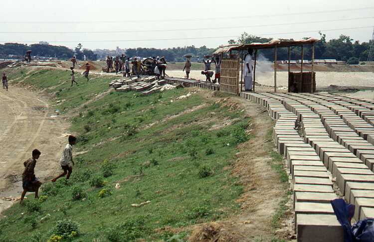 The dike around Dhaka under construction on the river side.