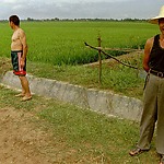 Chinese farmer in front of his rice field in the rural area near Wuhan.